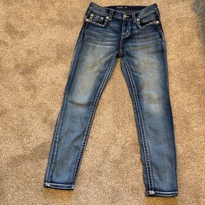 Women’s Miss Me “Hailey Skinny” blue jeans.